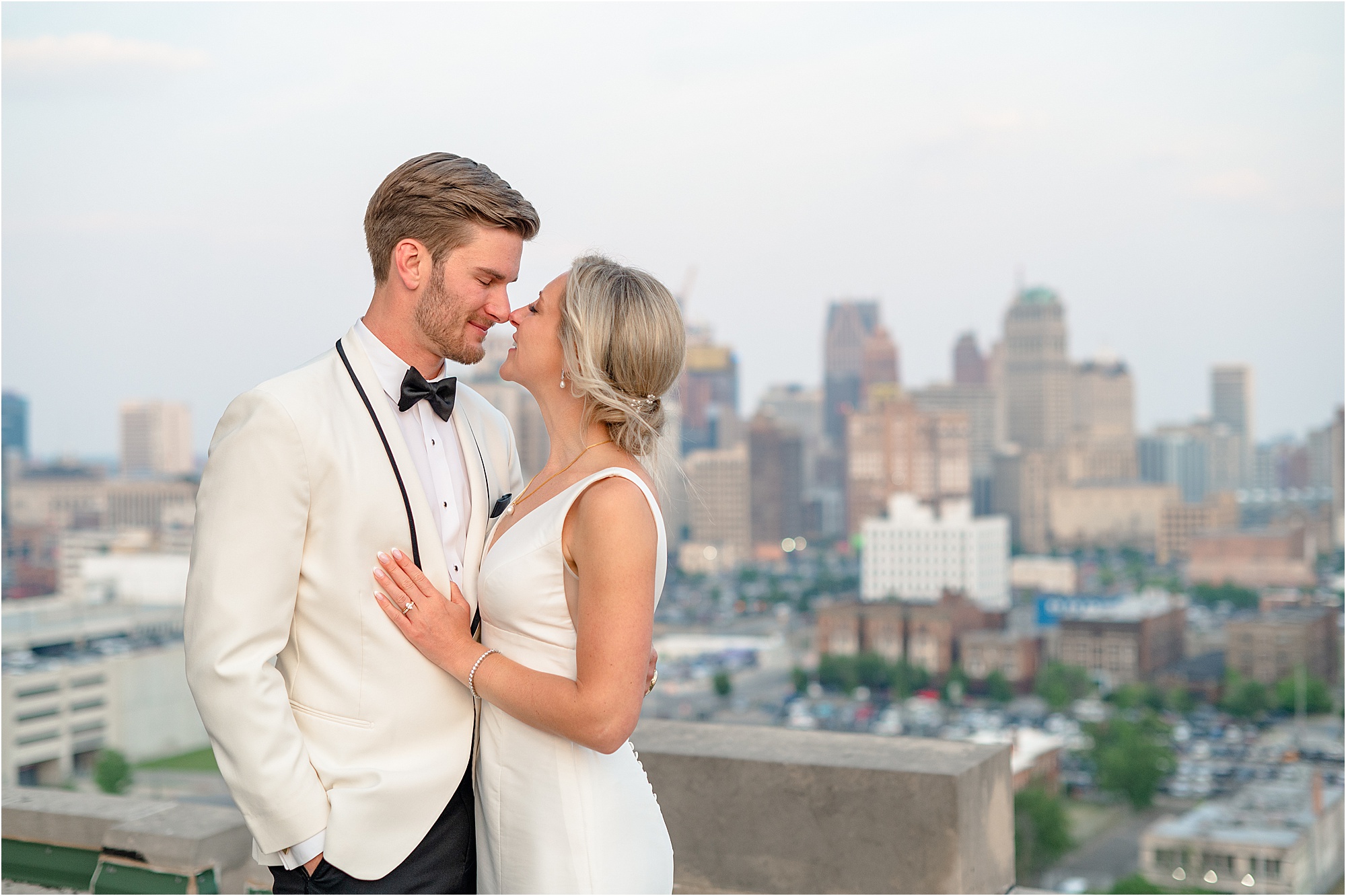 Alyssa and Adam on their wedding day on the Masonic Temple Detroit rooftop